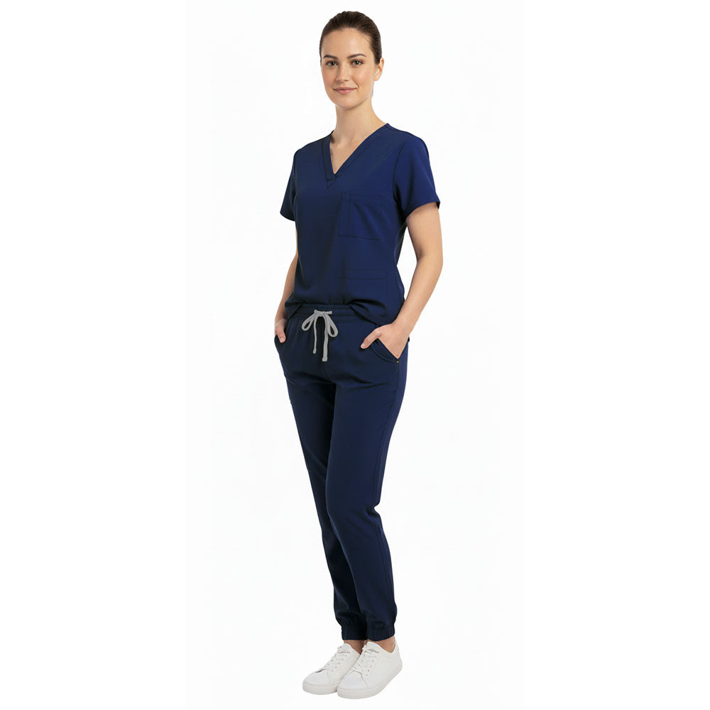 Healthcare professional utilizing functional pockets on Vicogard Navy Blue scrubs