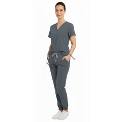 Nurse utilizing functional pockets on Vicogard Gray stretch scrub pants