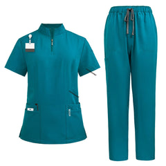 Flat lay of Teal surgical scrub set featuring zipper top and drawstring pants
