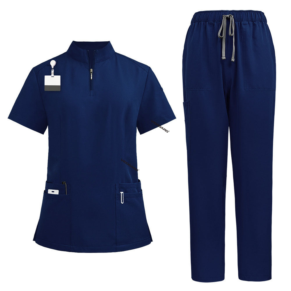 Flat lay of Galaxy Blue nursing scrubs featuring zipper mandarin collar top and cargo pants