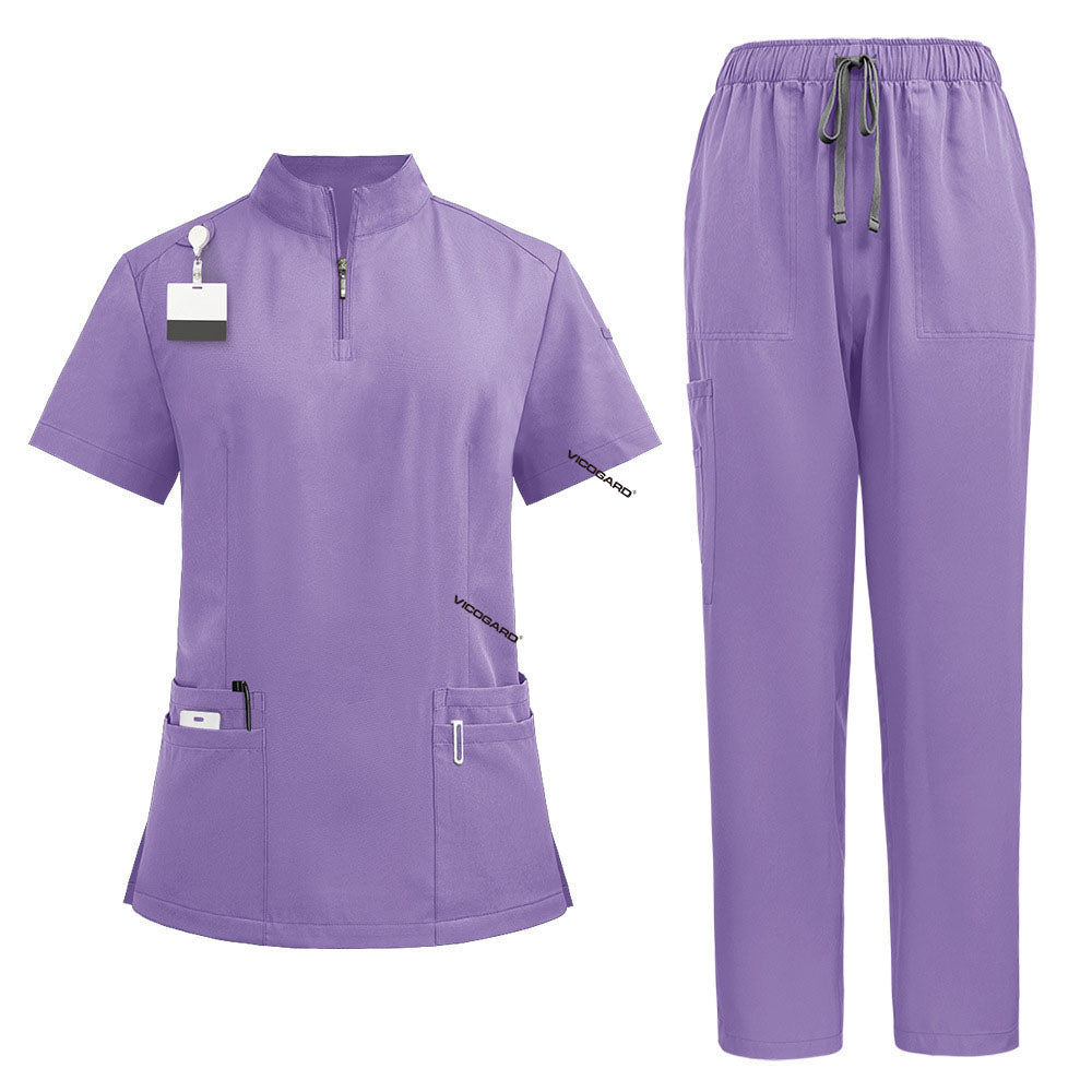 Flat lay of Lavender nursing scrubs featuring zipper mandarin collar top and cargo pants