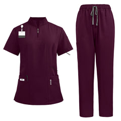 Flat lay of Wine colored scrubs featuring zipper mandarin collar top and cargo pants