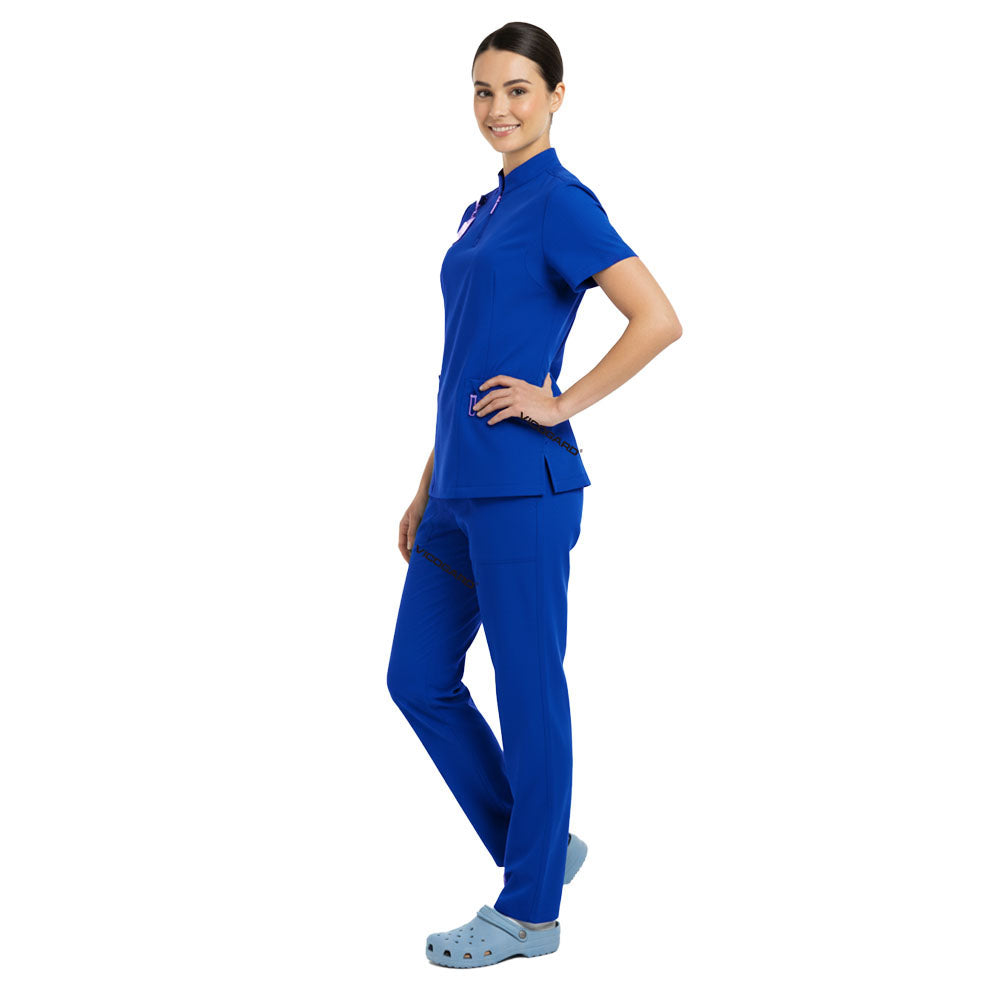 Side profile of Royal Blue scrub set showing athletic silhouette and deep cargo pockets