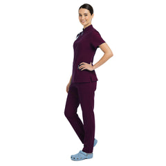 Side profile of Wine deep red scrubs showing cargo pockets and athletic silhouette