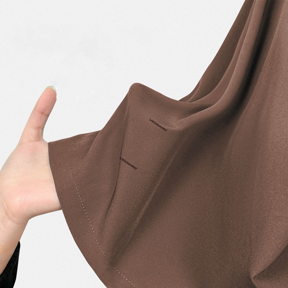 Close up of Coffee UltraSOFT fabric, wrinkle-resistant 4-way stretch brown texture