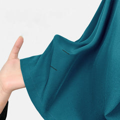 Close up of Teal UltraSOFT fabric, moisture-wicking 4-way stretch texture