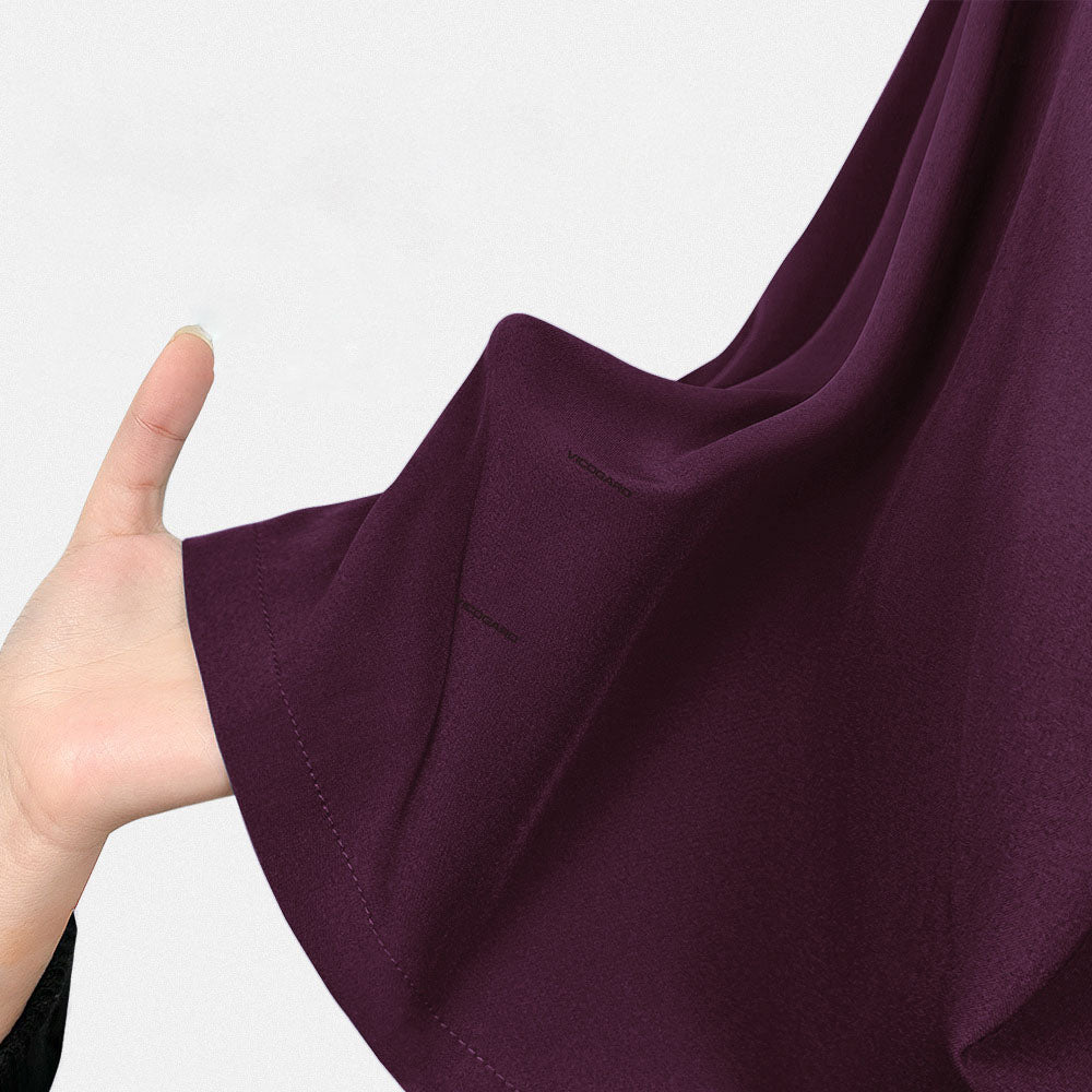 Close up of Wine UltraSOFT fabric, wrinkle-resistant 4-way stretch maroon texture