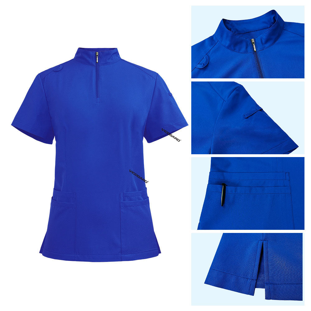 Detail of Royal Blue scrub top featuring half-zip neckline, shoulder badge loop, and chest pockets