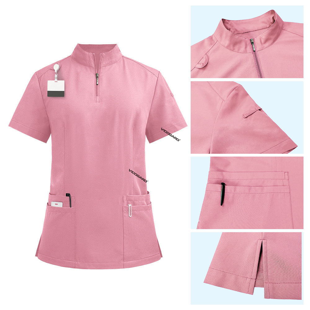 Detail of Pink scrub top featuring half-zip neckline, shoulder badge loop, and chest pockets